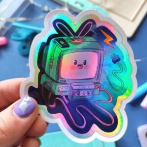 Novelty sticker Holographic 90s life Tv Tube, 90s Life Series - Tv Tube and VCR, Printed on Holographic sticker paper printed with eco-solvent ink and are liquid laminated for extra protection against scratches and the elements. perfect for laptops, water bottle customisations or even journals and planners for the nostalgia of growing up in the nineties