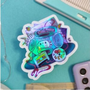 90s life Booming box - Holographic die cut sticker, Booming (Boom) Box radio, Printed on Holographic sticker paper printed with eco-solvent ink and are liquid laminated for extra protection against scratches and the elements. perfect for laptops, water bottle customisations or even journals and planners for the nostalgia of growing up in the nineties