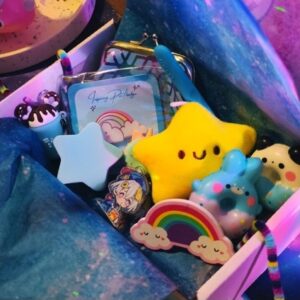 A Shiningstarr scoops magic filled order with cute plushie, rainbow magical items like pin badges, pens, keychains, coin pouches, squishies and more, only in south africa